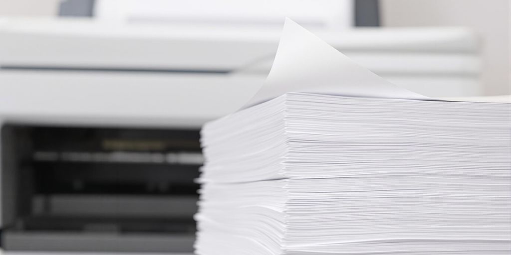 Resume pages next to a printer