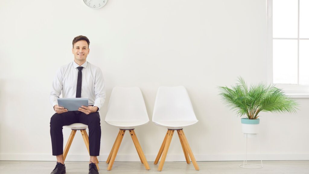 A man holding a customer service resume to apply